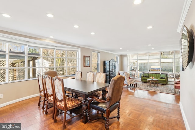 dining area featuring recessed lighting, baseboards, and ornamental molding