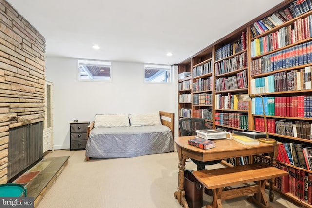 bedroom featuring carpet flooring, a fireplace, and recessed lighting