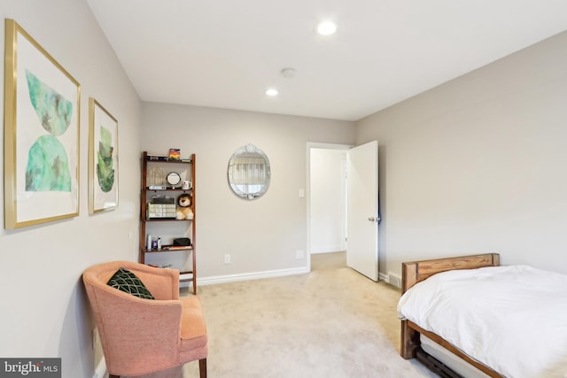 bedroom with light carpet, recessed lighting, and baseboards