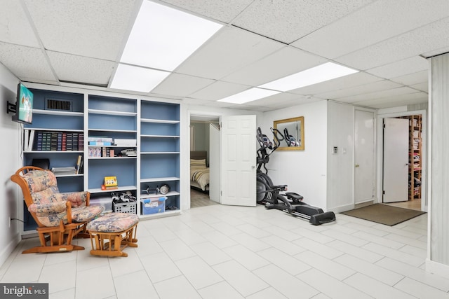 interior space featuring a drop ceiling