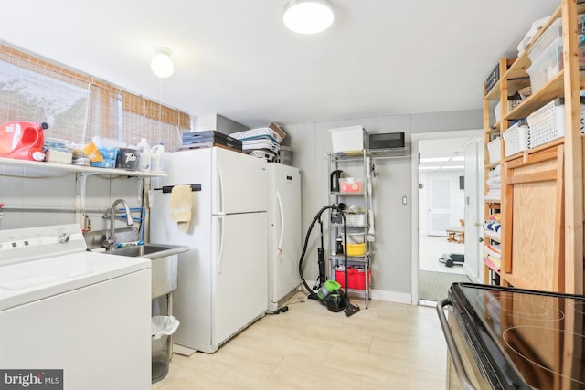 laundry room with washer / dryer and a sink