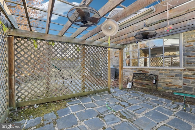 view of patio / terrace with fence, a ceiling fan, and a pergola