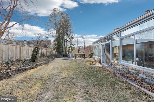 view of yard with a fenced backyard