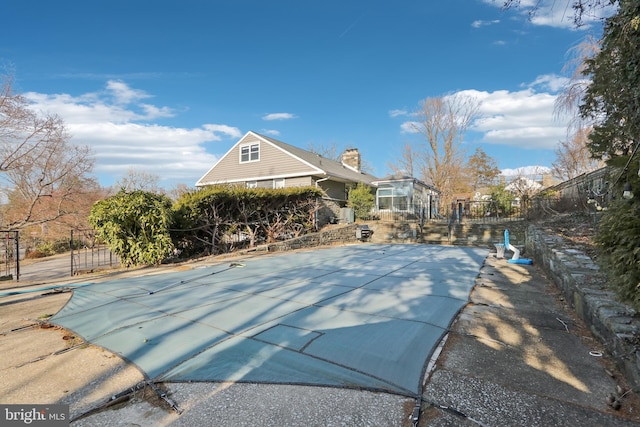 view of pool with fence