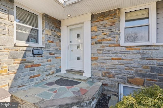 view of exterior entry with stone siding