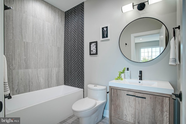 bathroom with toilet, shower / tub combination, and vanity