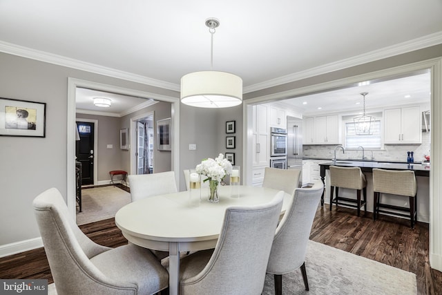 dining room featuring baseboards, dark wood-type flooring, and ornamental molding