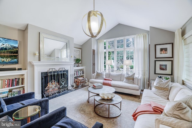 living room featuring lofted ceiling, a fireplace with flush hearth, and wood finished floors