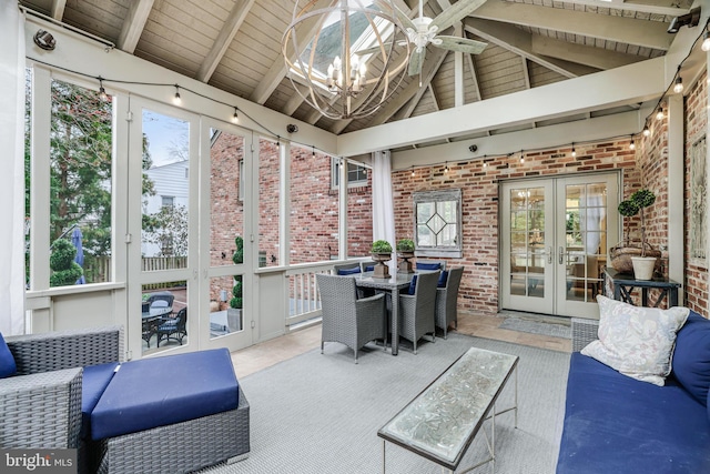 sunroom / solarium with a notable chandelier, wood ceiling, vaulted ceiling with beams, and french doors