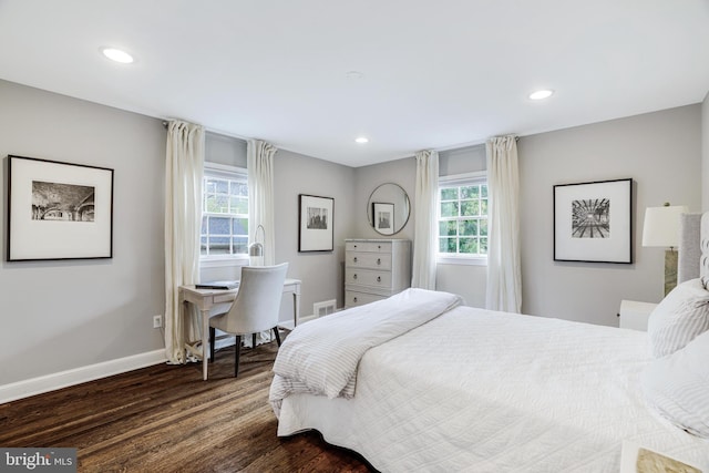 bedroom with dark wood-type flooring, multiple windows, recessed lighting, and baseboards