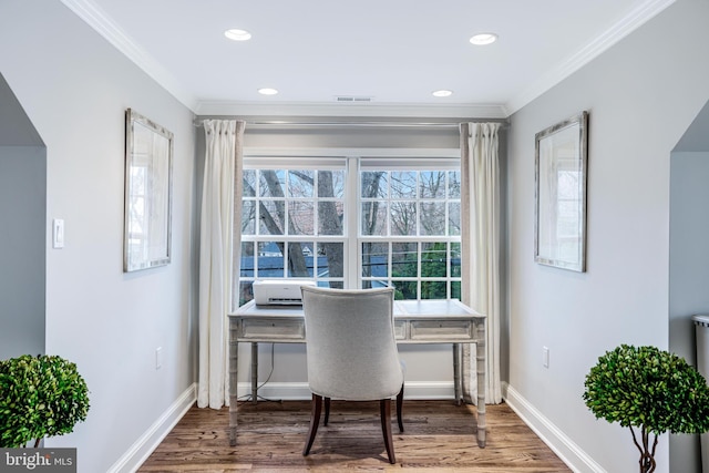 office area with baseboards, wood finished floors, and crown molding