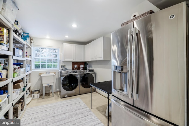 washroom with cabinet space, recessed lighting, and washing machine and dryer