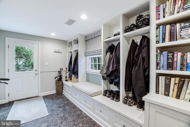 mudroom with recessed lighting, visible vents, and wainscoting