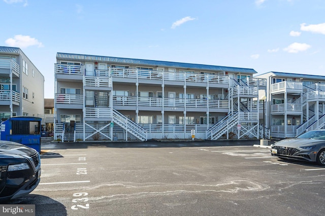 view of building exterior featuring uncovered parking