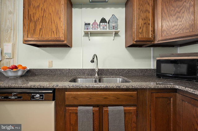 kitchen with dishwasher, a sink, black microwave, and brown cabinets