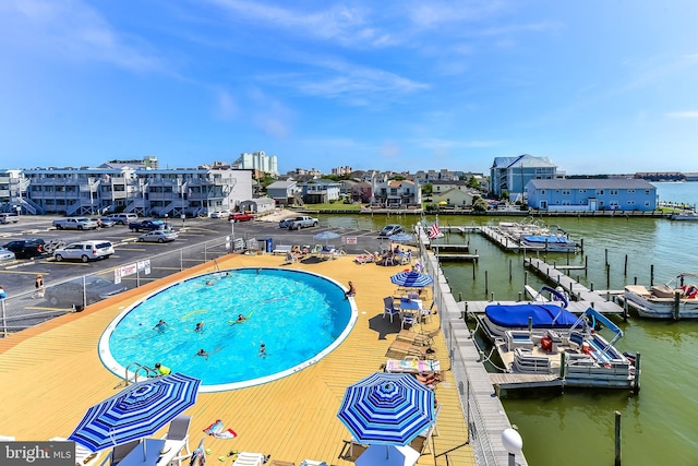 view of pool with a water view