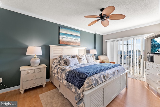 bedroom with access to exterior, crown molding, light wood-style floors, a textured ceiling, and baseboards