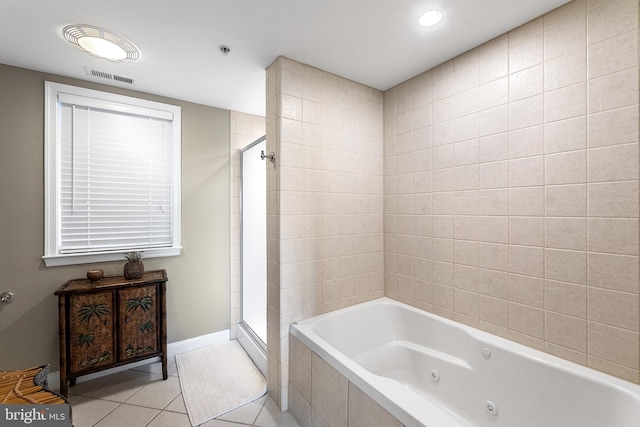 full bathroom featuring visible vents, a stall shower, tile patterned flooring, baseboards, and a tub with jets