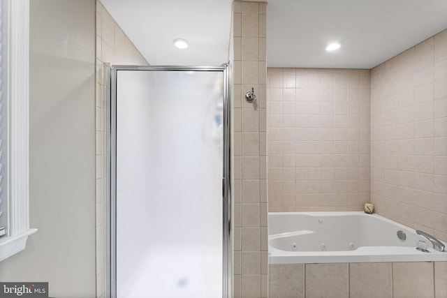 full bath featuring a tub with jets, a stall shower, and recessed lighting