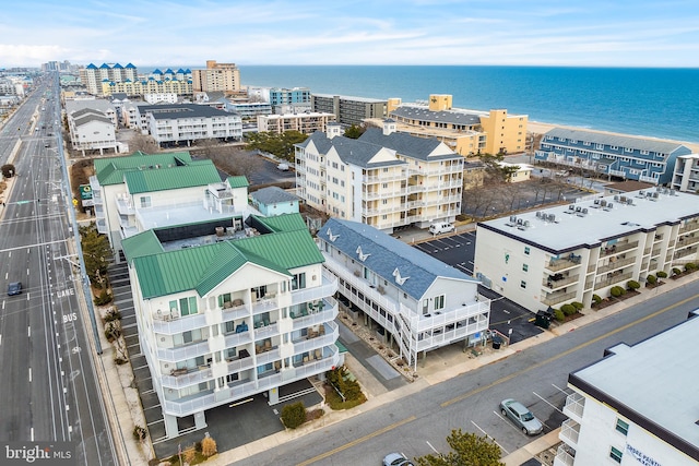 aerial view featuring a city view and a water view