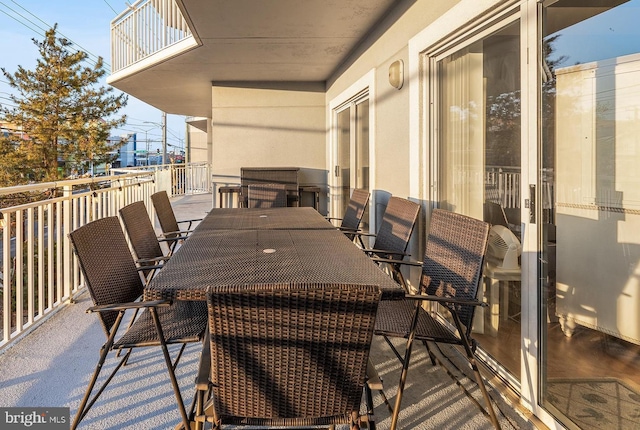 balcony featuring outdoor dining area