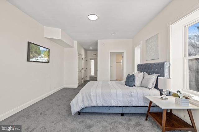 bedroom featuring carpet floors and baseboards