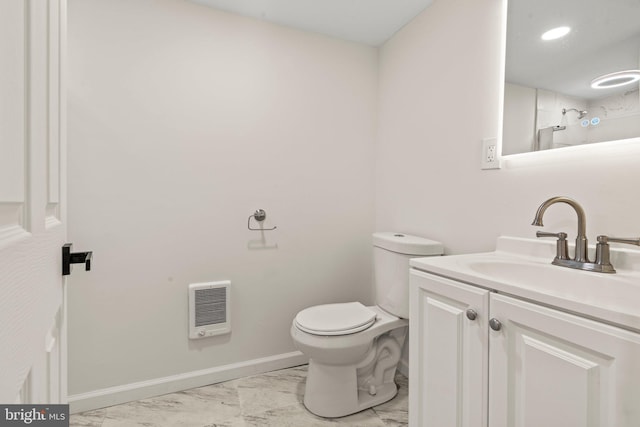 bathroom with baseboards, toilet, heating unit, marble finish floor, and vanity