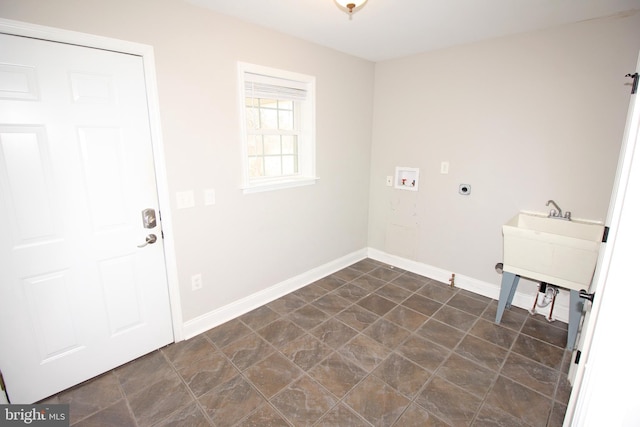 clothes washing area with laundry area, hookup for a washing machine, baseboards, and hookup for an electric dryer