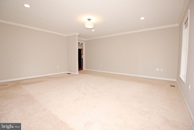 unfurnished room with ornamental molding, recessed lighting, light carpet, and baseboards