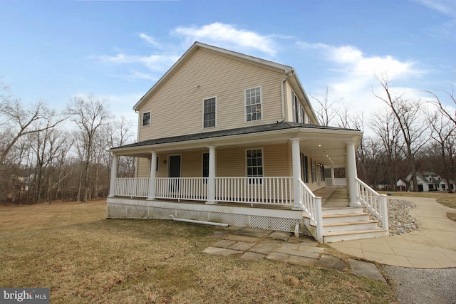 country-style home featuring covered porch and a front lawn