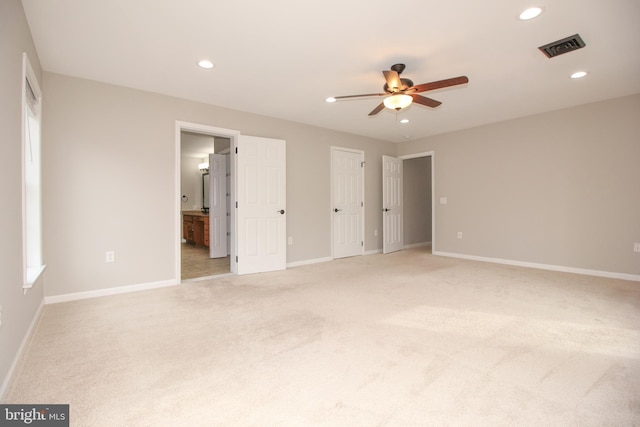 unfurnished bedroom featuring baseboards, visible vents, and recessed lighting