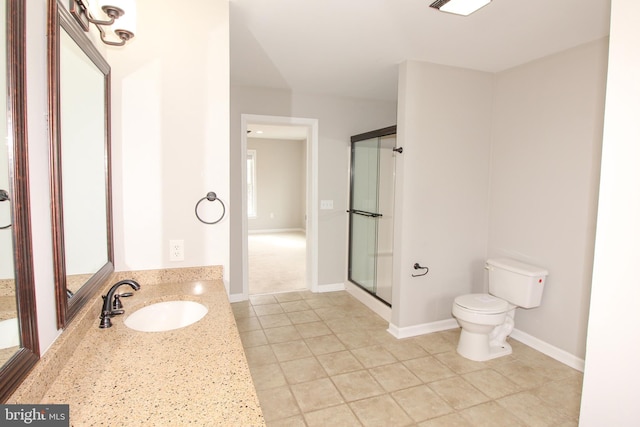 full bath featuring baseboards, toilet, tile patterned floors, a shower with shower door, and vanity