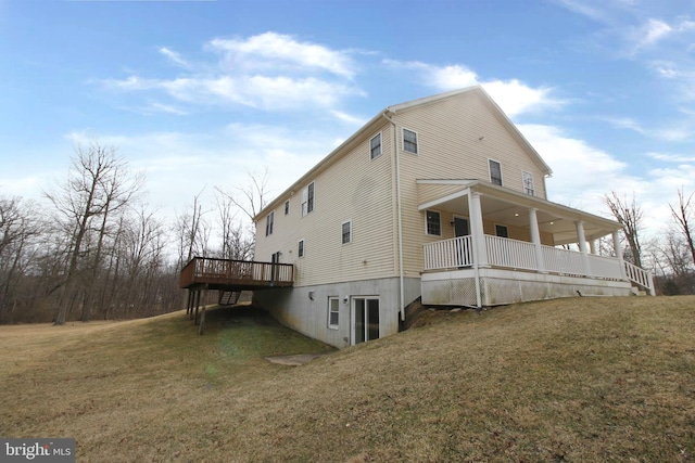 rear view of property with a yard