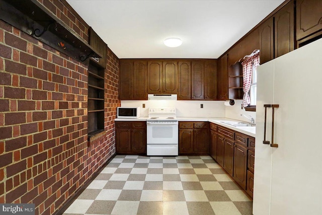 kitchen with exhaust hood, white appliances, light floors, and open shelves