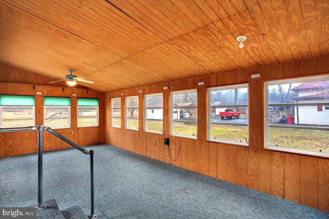 unfurnished sunroom with a ceiling fan, lofted ceiling, and wooden ceiling