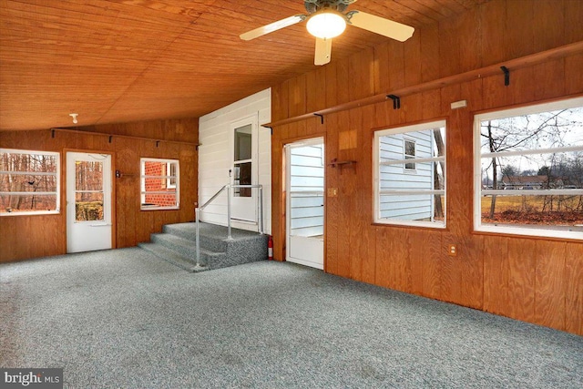 unfurnished sunroom featuring vaulted ceiling, ceiling fan, and wood ceiling