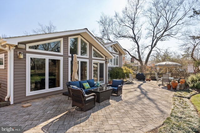 view of patio / terrace featuring an outdoor living space and fence