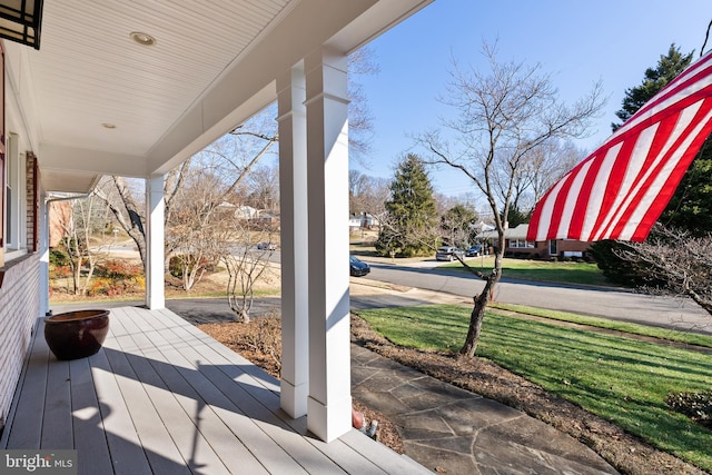 wooden deck featuring covered porch