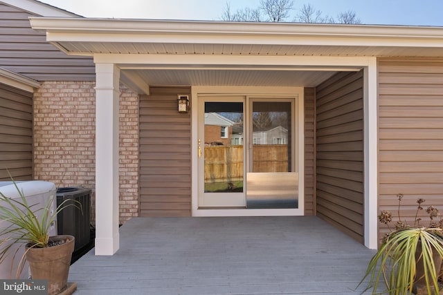 doorway to property featuring cooling unit