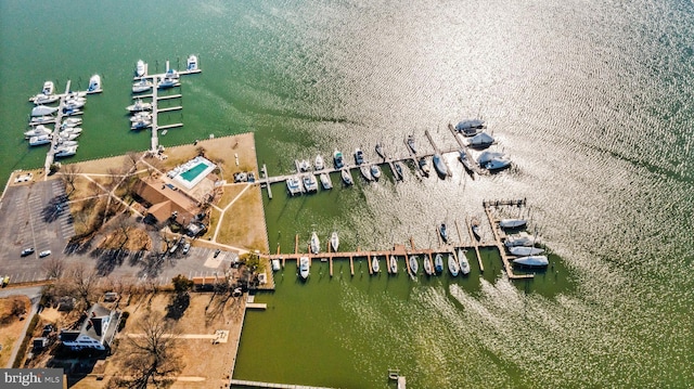 birds eye view of property with a water view