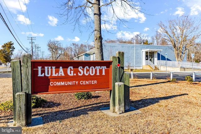 community sign with fence