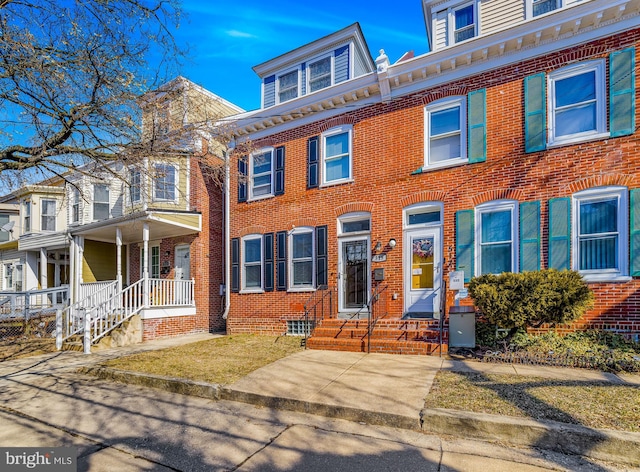 view of front of home featuring brick siding