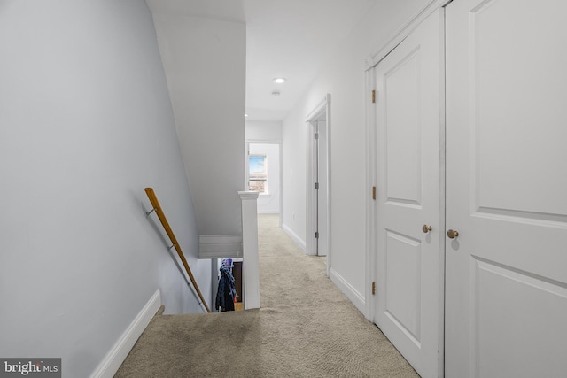 hallway featuring recessed lighting, carpet, an upstairs landing, and baseboards