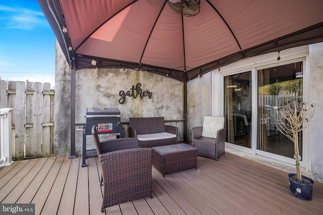 deck with a grill and a gazebo