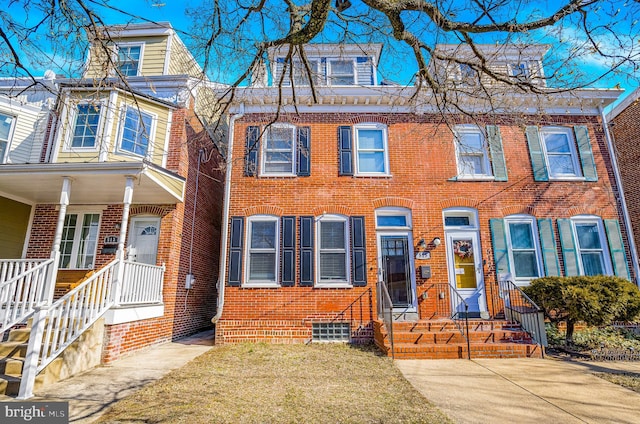 view of front of home featuring brick siding