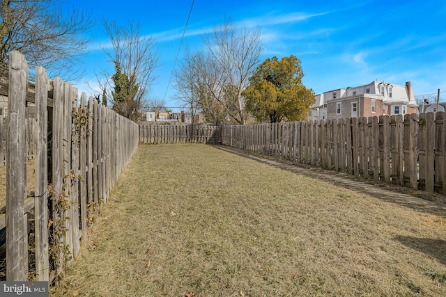 view of yard with a fenced backyard