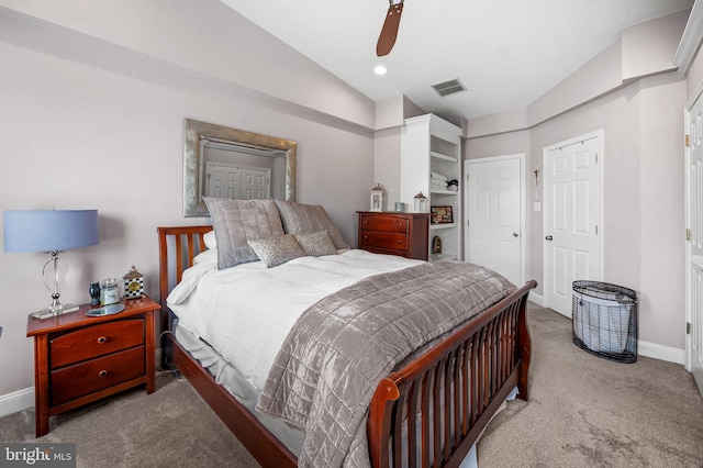 bedroom featuring ceiling fan, carpet, visible vents, and baseboards