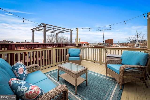 deck featuring an outdoor living space and a pergola