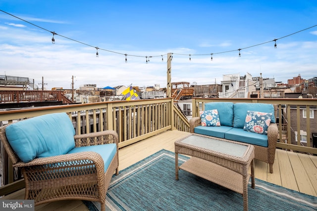 wooden deck featuring an outdoor hangout area