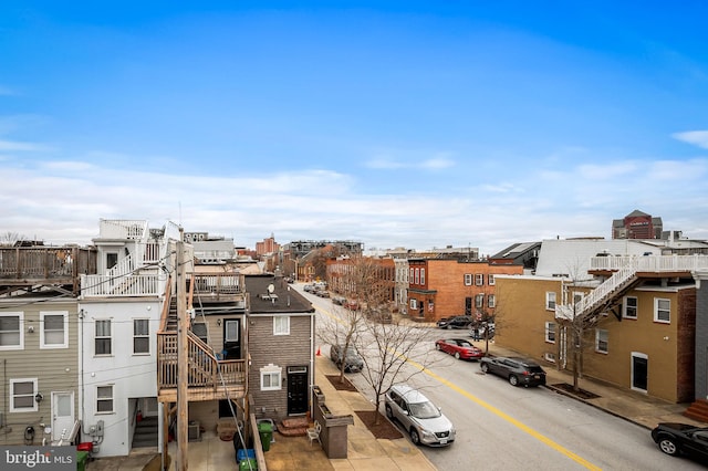 exterior space with a city view, curbs, and sidewalks